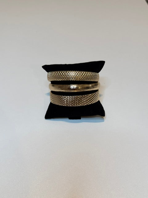 Large gold bangle stack of 3
